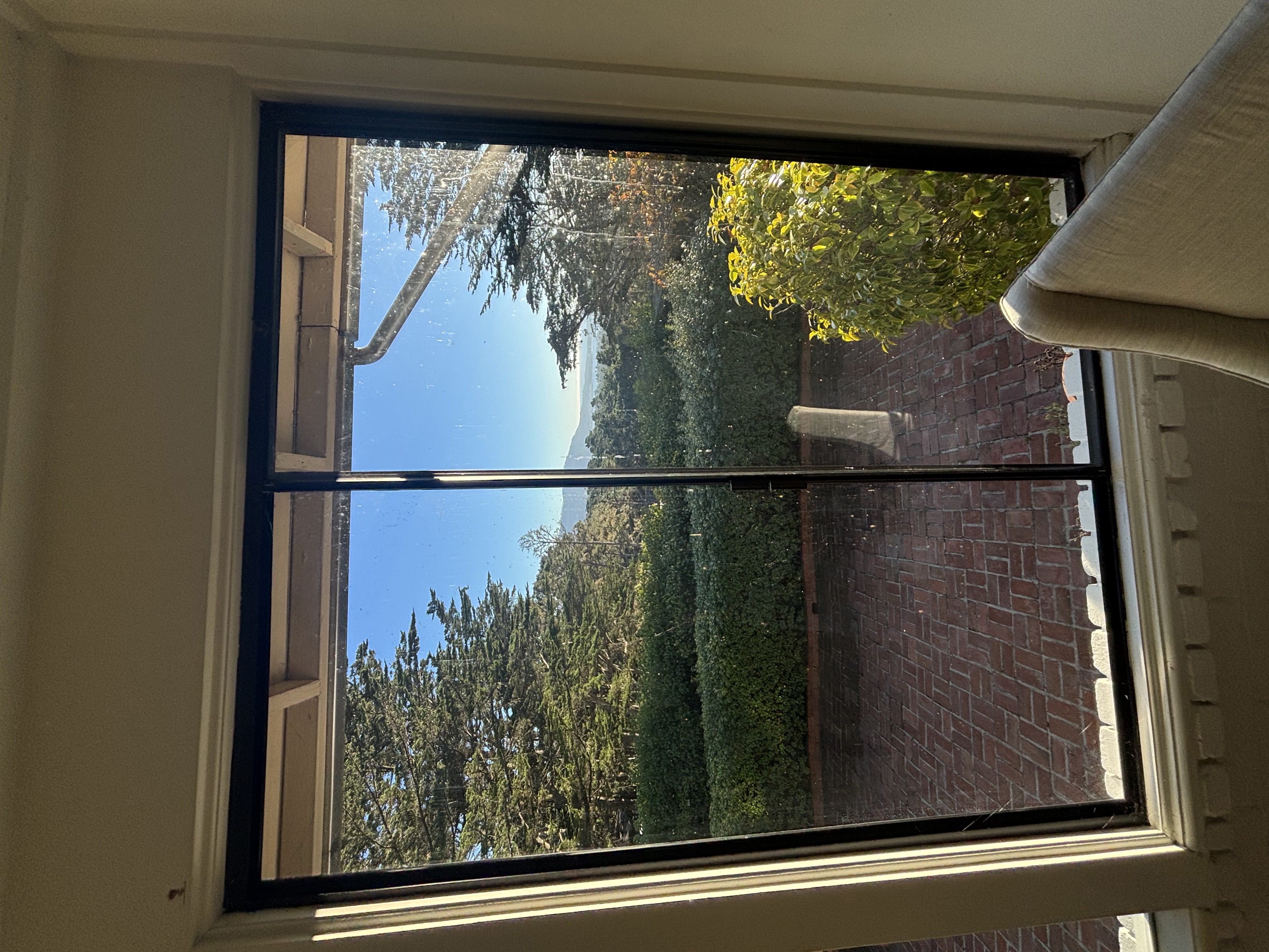 Clean interior window with mountain and ocean views