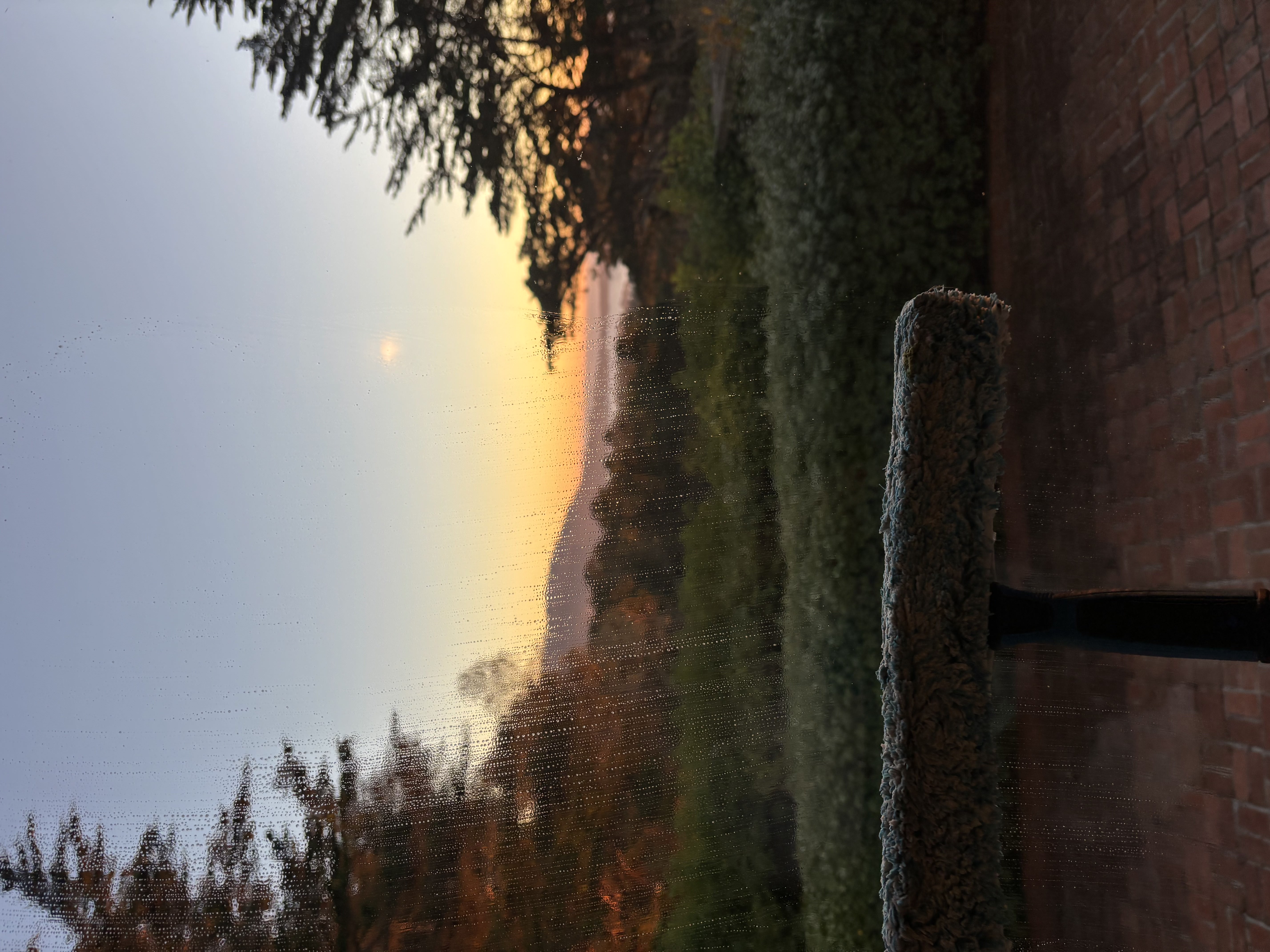 Clean window with beautiful sunset and ocean view